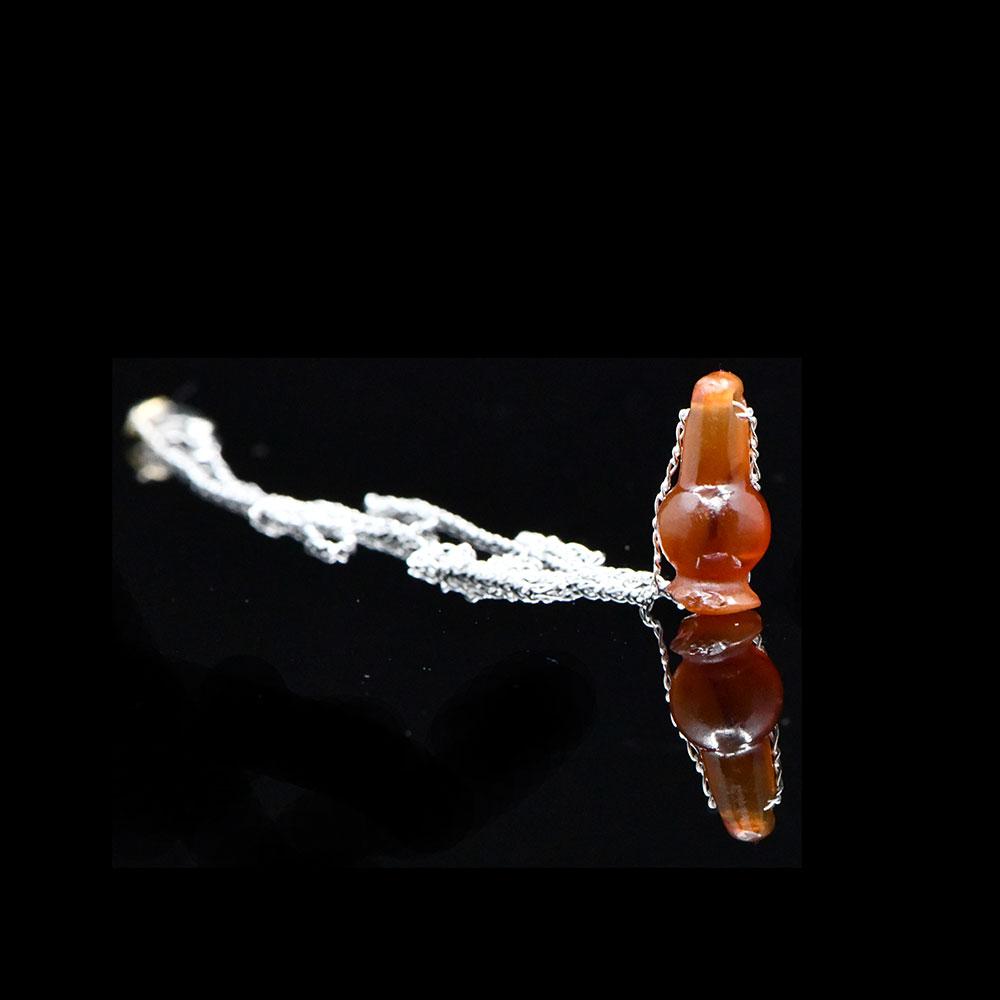 ایک مصری کارنیلین پوست کے مالا لاکٹ ، نیو کنگڈم ، 18 ویں - 19 ویں خاندان ، سی اے۔ 1550 - 1295 قبل مسیح