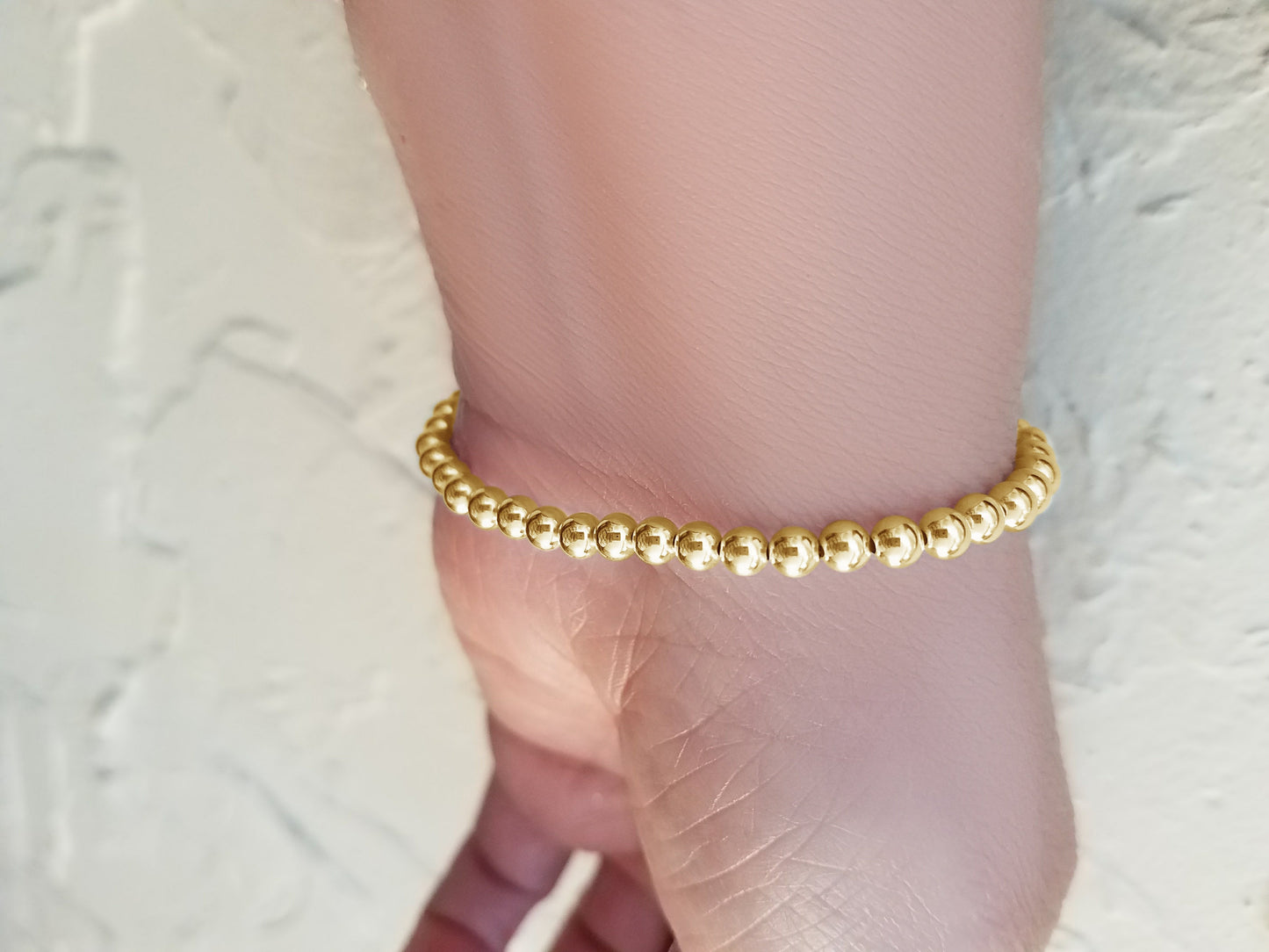 Perlenarmband aus Gelbgold, 4 mm