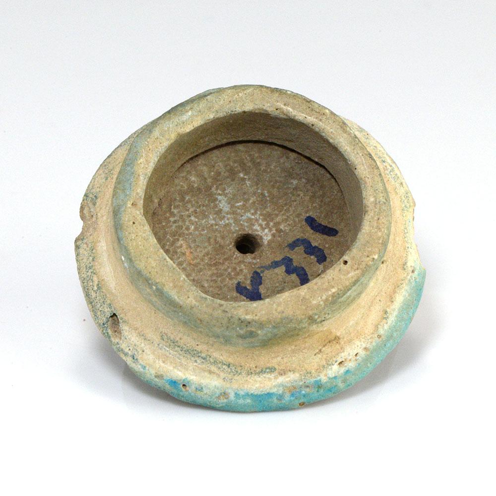 ایک مصری faience er spool ، 18 ویں خاندان ، امرنا پیریڈ ، CA 1352-1336 BCE