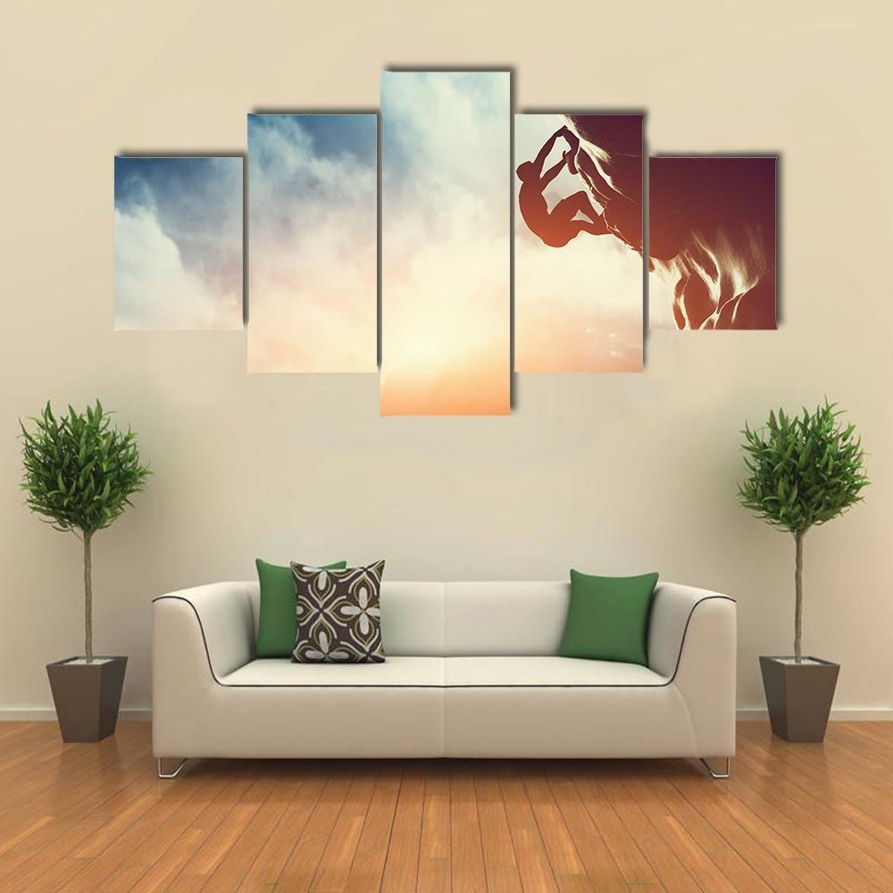 Silhouette Of Man Climbing On Rock Canvas Wall Art-5 Star-Gallery Wrap-62" x 32"-Tiaracle