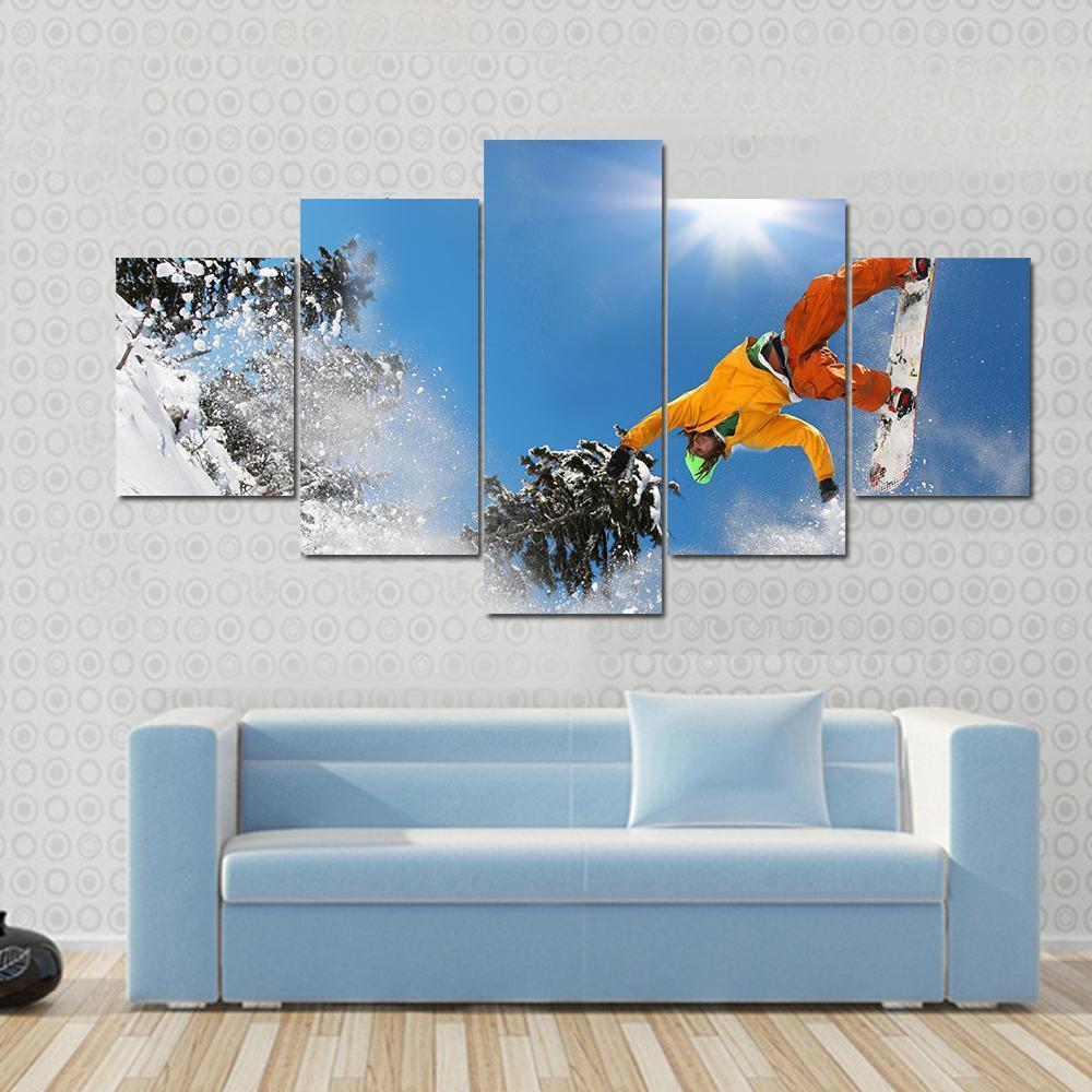 Snowboarder Jumping Against Blue Sky Canvas Wall Art-5 Star-Gallery Wrap-62" x 32"-Tiaracle