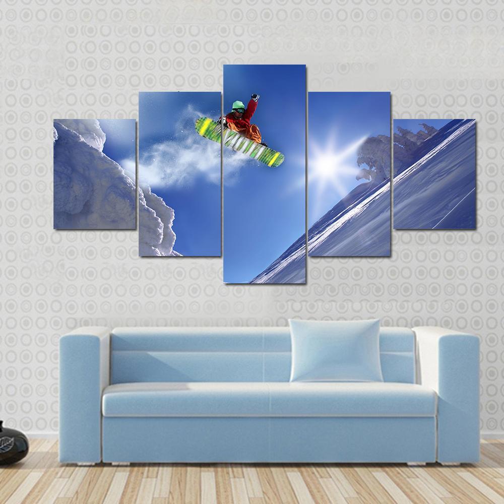 Snowboarder Jumping Against Blue Sky Canvas Wall Art-5 Star-Gallery Wrap-62" x 32"-Tiaracle