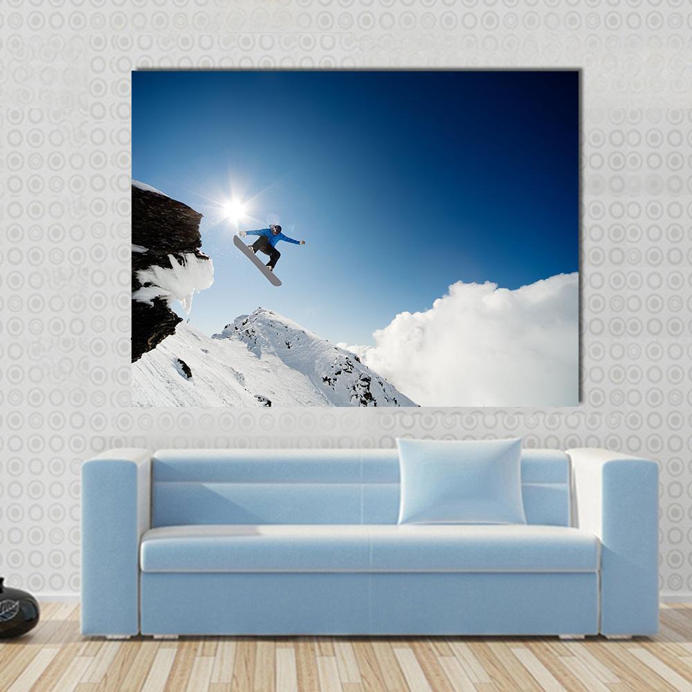 Snowboarder Jumping Through Air After Rock Drop Canvas Wall Art-1 Piece-Gallery Wrap-48" x 32"-Tiaracle