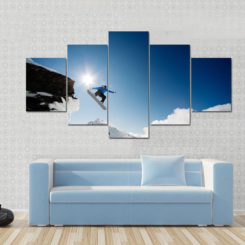 Snowboarder Jumping Through Air After Rock Drop Canvas Wall Art-3 Horizontal-Gallery Wrap-25" x 16"-Tiaracle