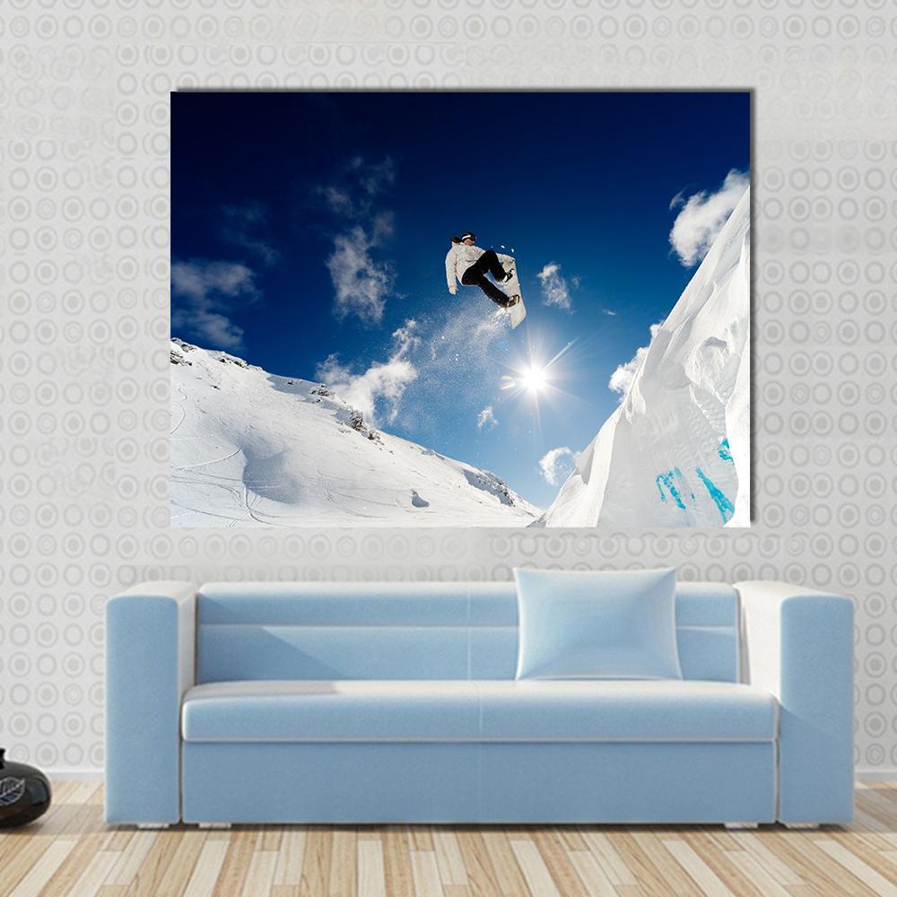 Snowboarder Jumping Through The Air With Blue Sky Canvas Wall Art-1 Piece-Gallery Wrap-48" x 32"-Tiaracle