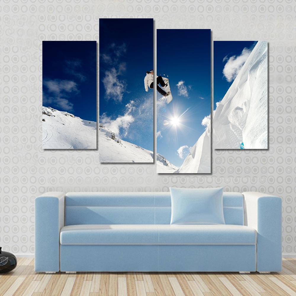 Snowboarder Jumping Through The Air With Blue Sky Canvas Wall Art-4 Pop-Gallery Wrap-50" x 32"-Tiaracle