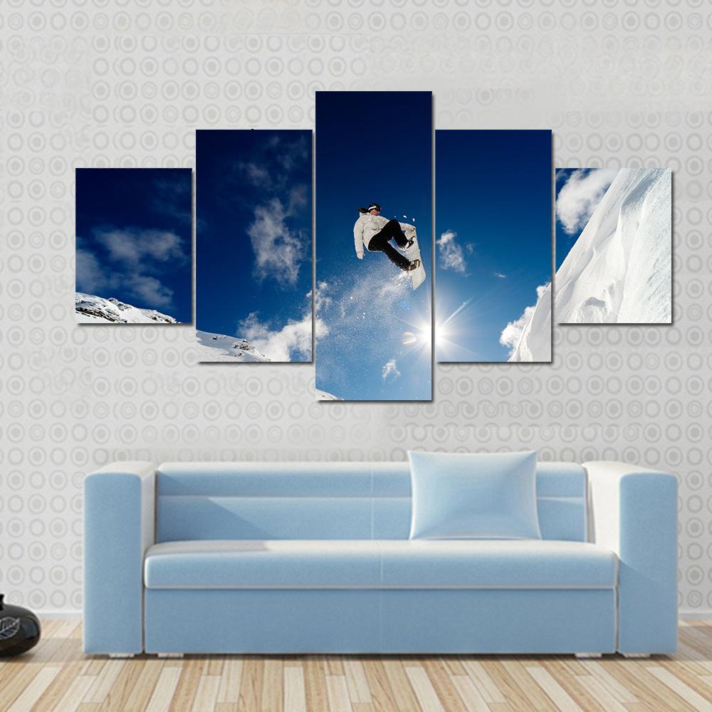 Snowboarder Jumping Through The Air With Blue Sky Canvas Wall Art-5 Star-Gallery Wrap-62" x 32"-Tiaracle