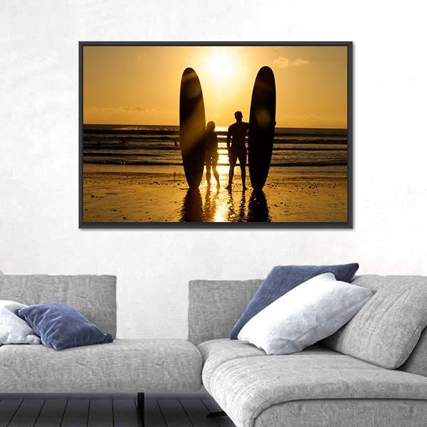 Surfer Couple Holding Long Surf Boards At Sunset On Beach Canvas Wall Art-3 Horizontal-Gallery Wrap-25" x 16"-Tiaracle