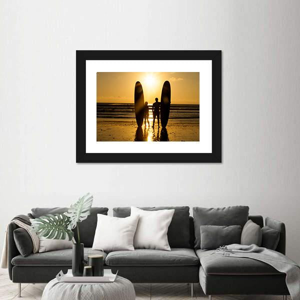 Surfer Couple Holding Long Surf Boards At Sunset On Beach Canvas Wall Art-3 Horizontal-Gallery Wrap-25" x 16"-Tiaracle