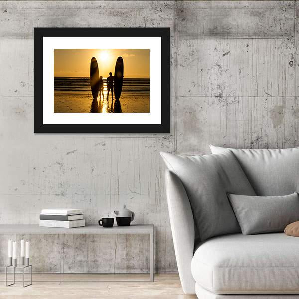 Surfer Couple Holding Long Surf Boards At Sunset On Beach Canvas Wall Art-3 Horizontal-Gallery Wrap-25" x 16"-Tiaracle