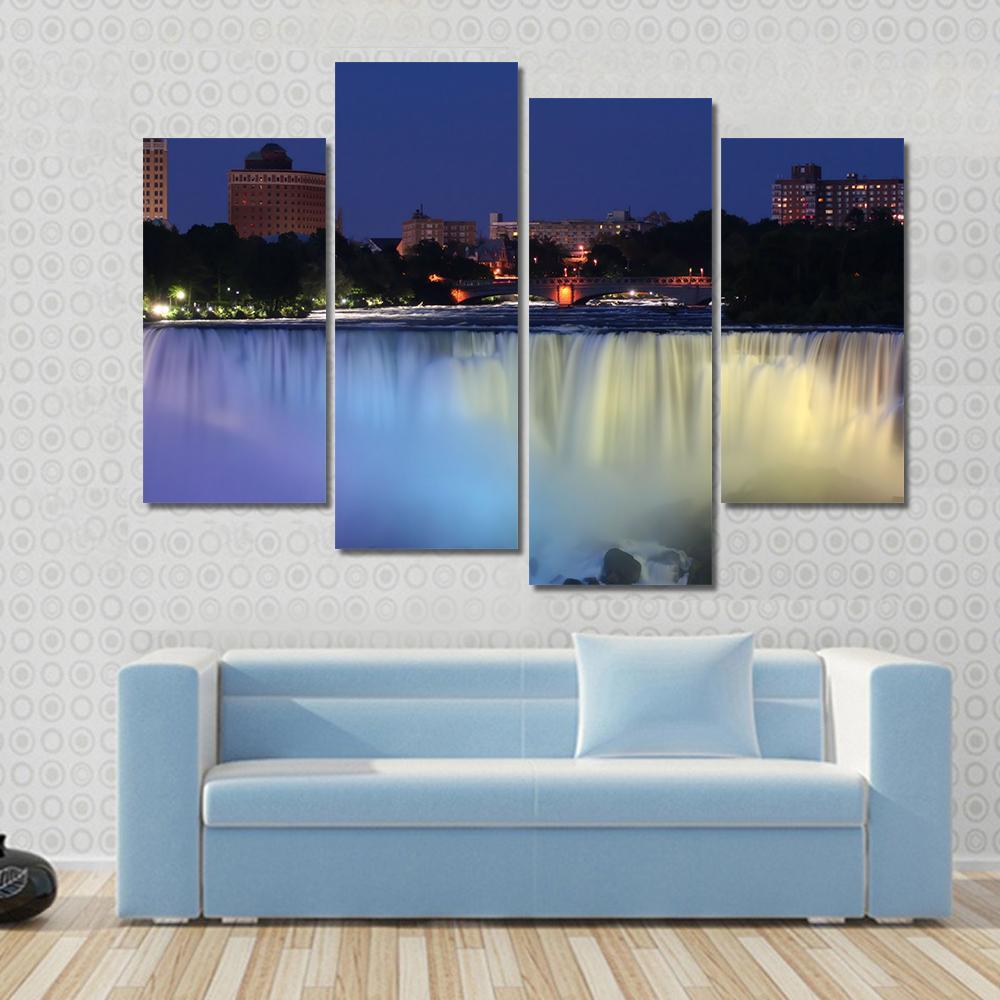 Waterfall With City At Night Above With Lights Canvas Wall Art-4 Pop-Gallery Wrap-50" x 32"-Tiaracle